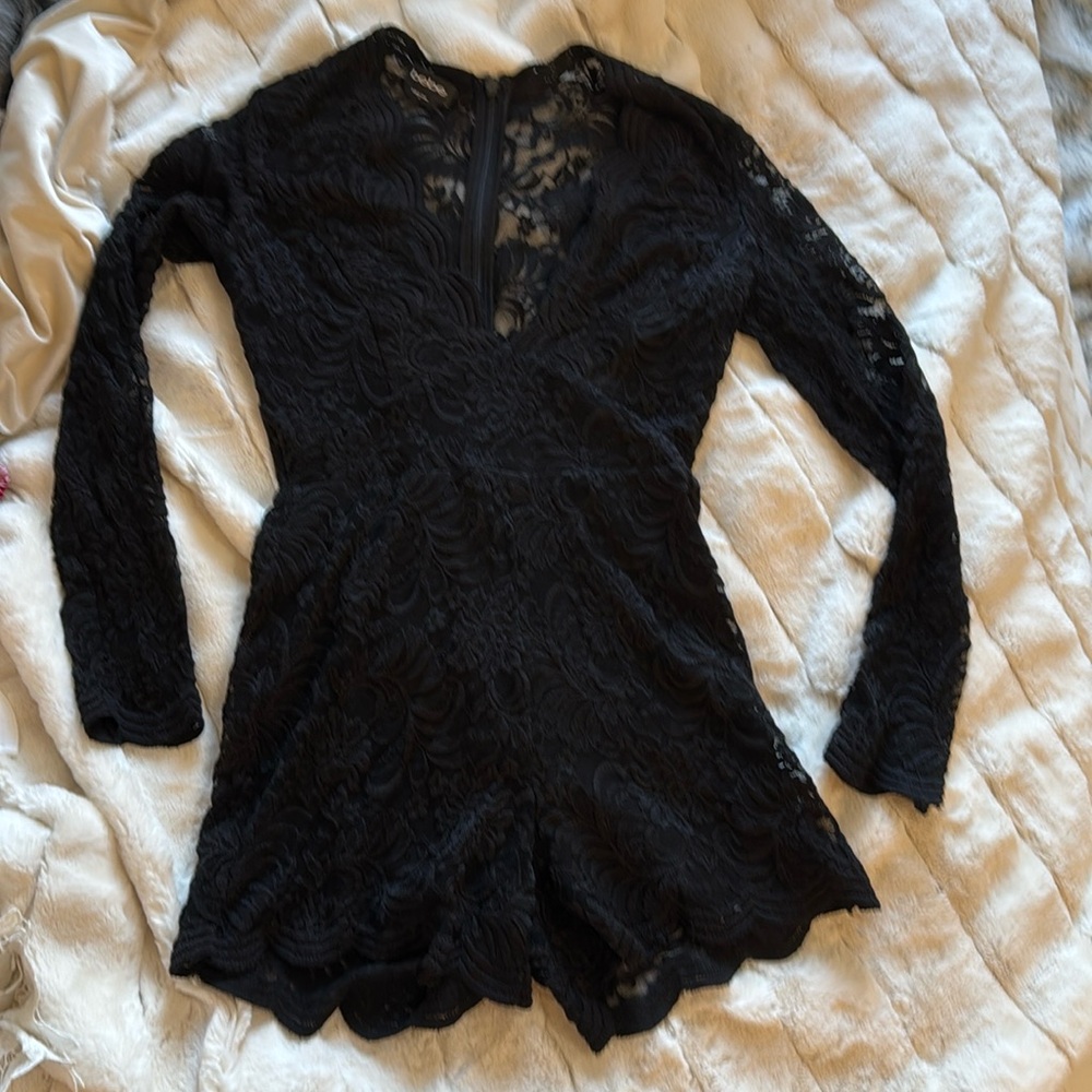 Bebe stretch lace romper with back hidden zipper.
